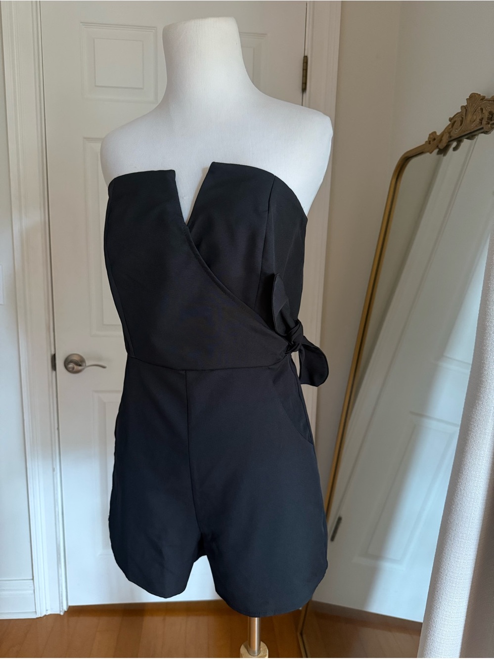 She + Sky Black Tailored shorts romper in size medium with cute side tie!